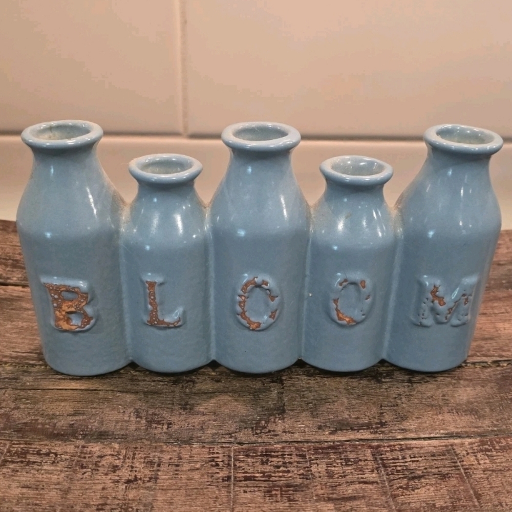 Five Attached Blue Bud Vases Spelling BLOOM